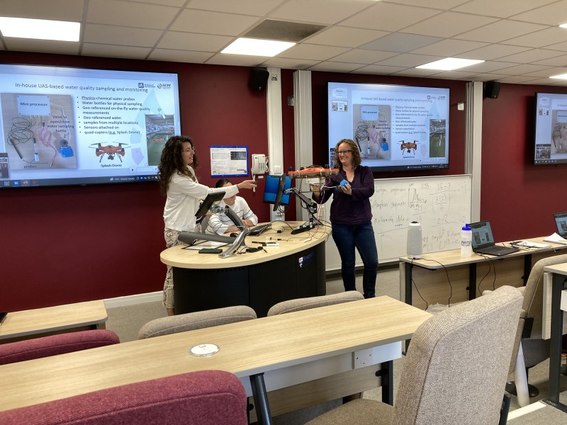 Dr Maria Valasia Peppa and Dr Claire Walsh from Newcastle University demonstrate drone equipment used for water quality sampling